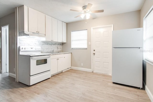 kitchen with light wood finished floors, white appliances, tasteful backsplash, and white cabinetry