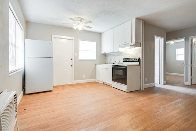 kitchen featuring light wood finished floors, under cabinet range hood, decorative backsplash, white cabinets, and white appliances