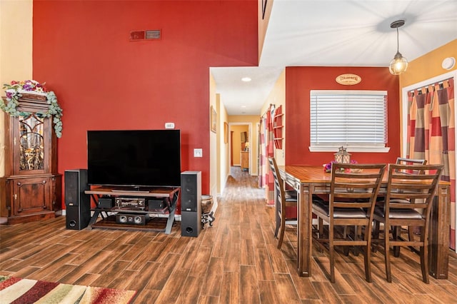 dining area featuring wood finished floors and visible vents