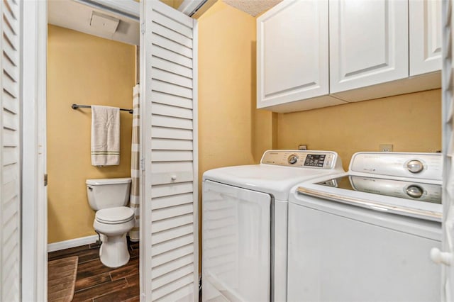 laundry room featuring laundry area, baseboards, independent washer and dryer, and wood tiled floor