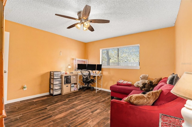 office with a textured ceiling, a ceiling fan, baseboards, and wood finished floors