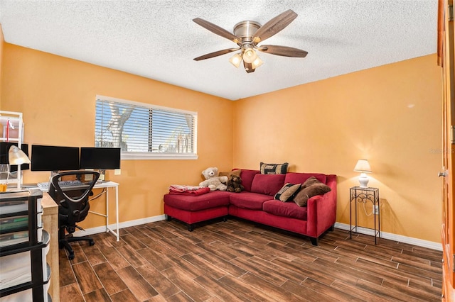 office area featuring a textured ceiling, baseboards, ceiling fan, and wood tiled floor