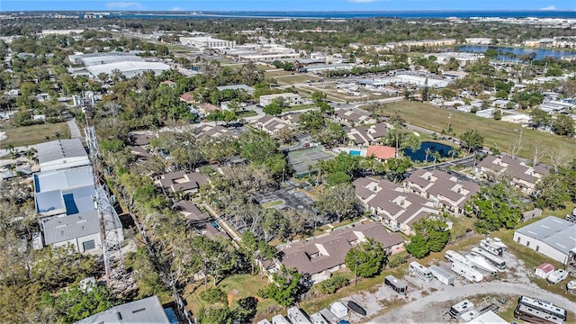 birds eye view of property with a residential view and a water view