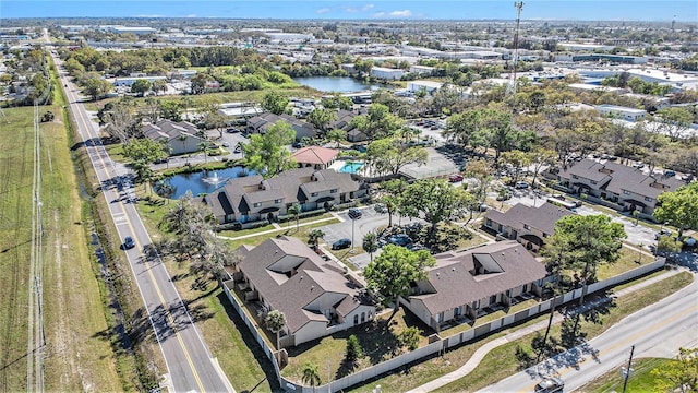 bird's eye view with a residential view and a water view