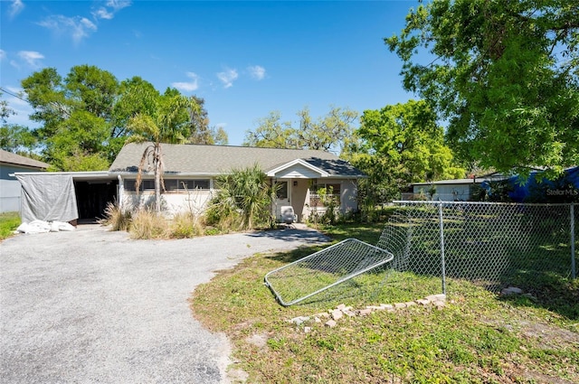 view of front of property with fence and driveway