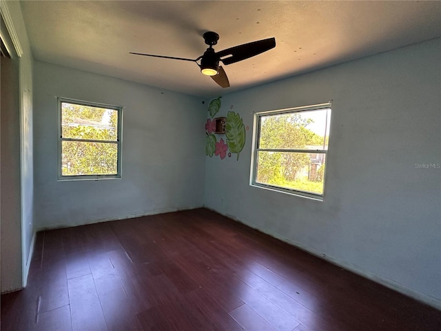 unfurnished room with ceiling fan and wood finished floors