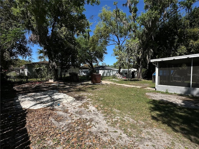 view of yard with a sunroom