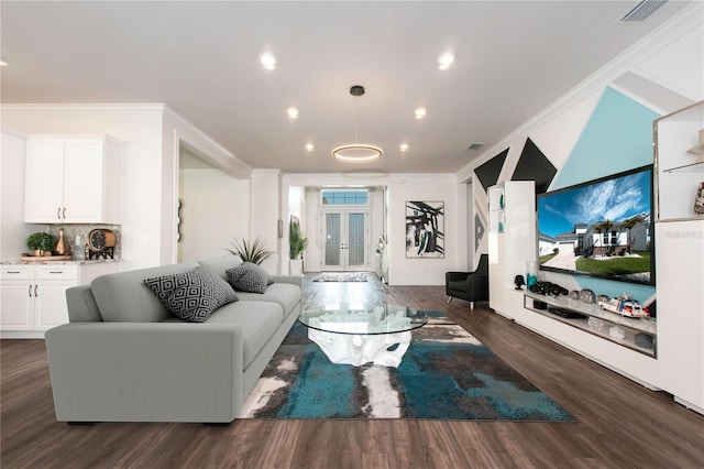 living area featuring visible vents, dark wood finished floors, recessed lighting, french doors, and crown molding