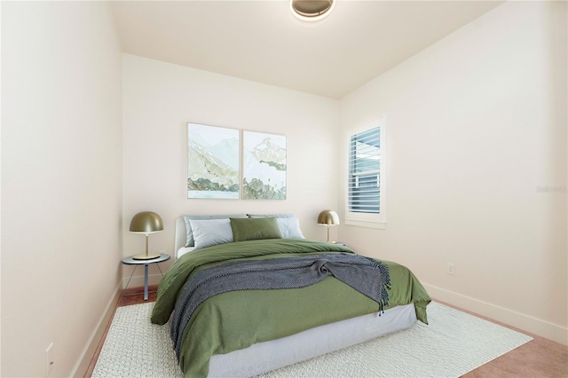 bedroom featuring baseboards