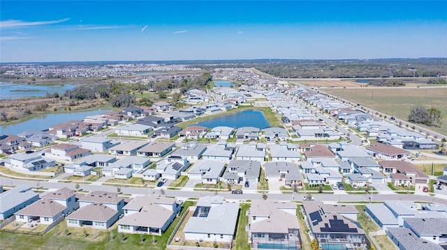 bird's eye view featuring a water view and a residential view