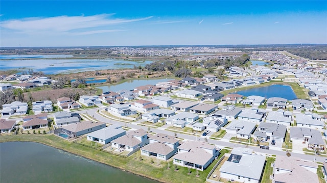 bird's eye view with a residential view and a water view