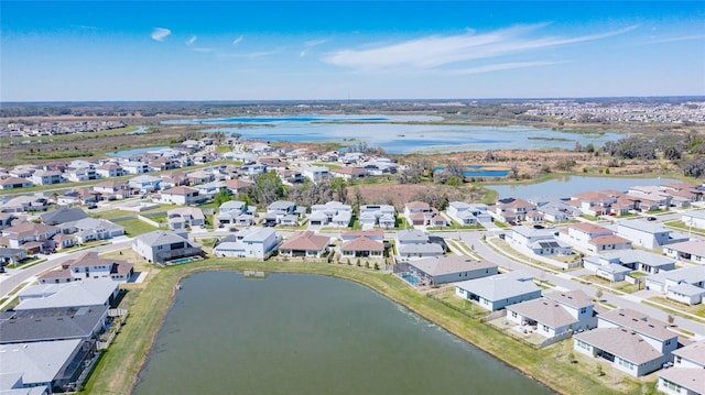 aerial view with a residential view and a water view