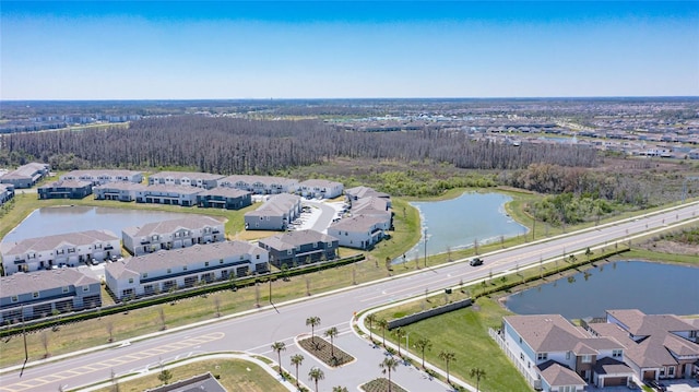 bird's eye view featuring a water view and a residential view