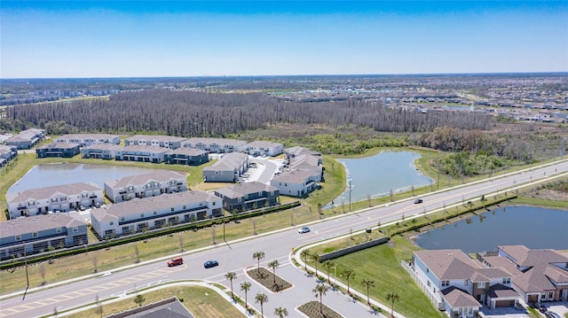 aerial view with a residential view and a water view