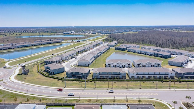 birds eye view of property featuring a residential view and a water view