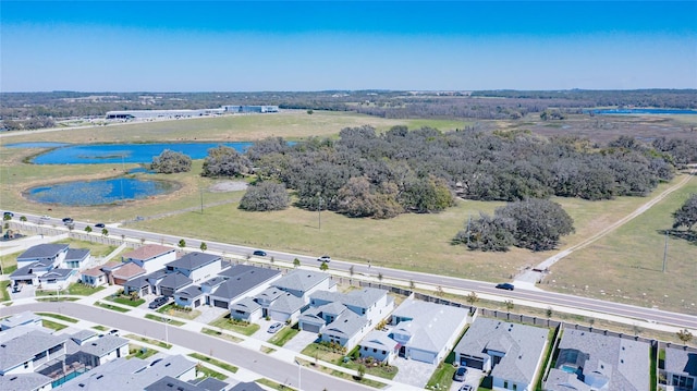 aerial view with a residential view and a water view