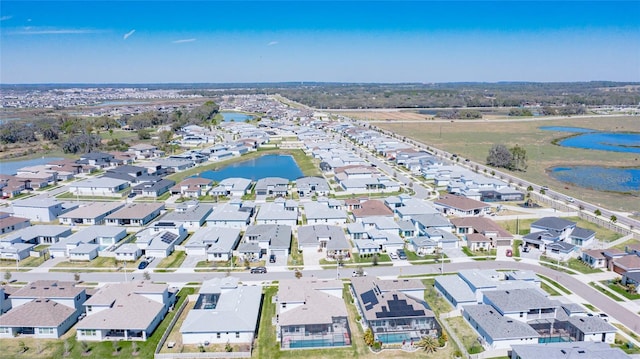 bird's eye view featuring a residential view and a water view