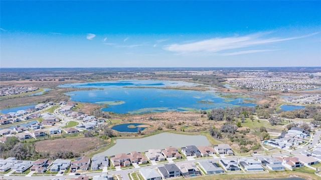 aerial view with a residential view and a water view