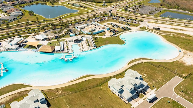 birds eye view of property featuring a water view