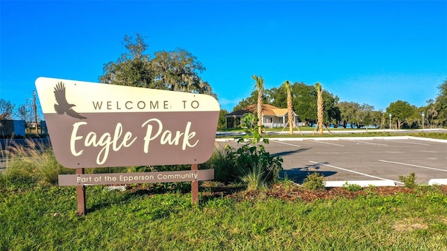 community sign with uncovered parking