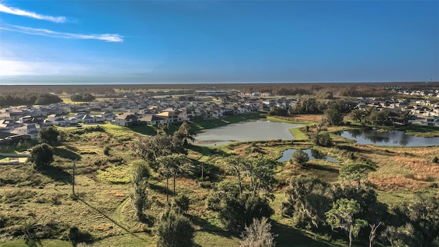 birds eye view of property with a residential view and a water view