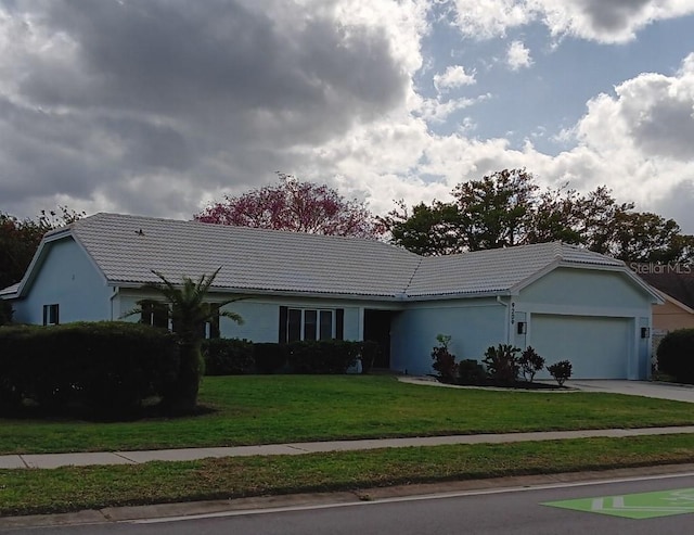 single story home with a front yard, a garage, a tile roof, and driveway