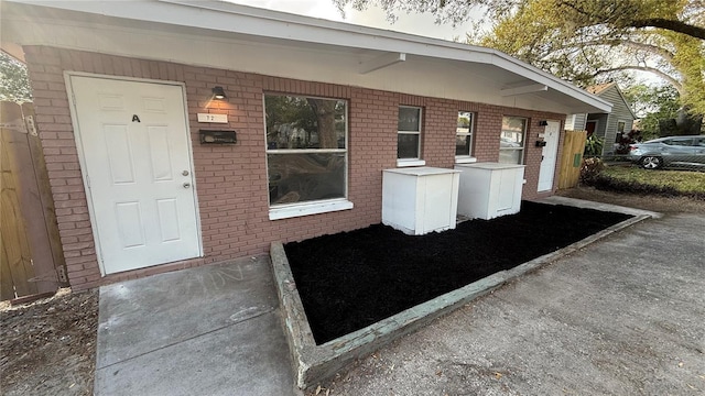 exterior space with brick siding