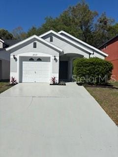 view of front of house with driveway and a garage