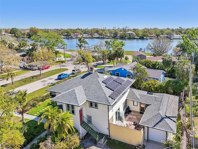 bird's eye view featuring a residential view and a water view