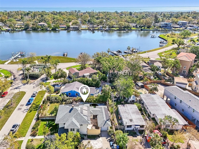 birds eye view of property featuring a water view and a residential view