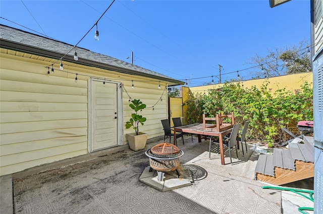 view of patio / terrace featuring an outdoor fire pit