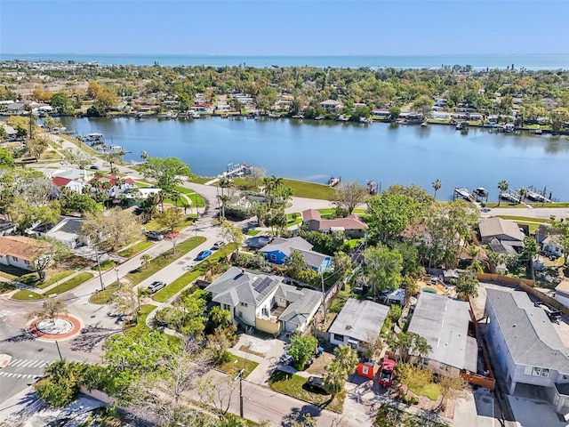 birds eye view of property with a water view and a residential view