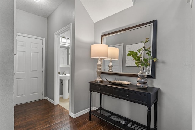 foyer entrance featuring wood finished floors and baseboards