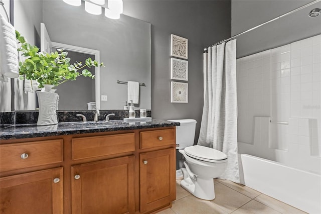 bathroom featuring vanity, tile patterned floors, toilet, and shower / bath combo