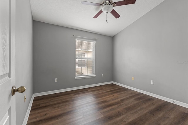 unfurnished room with dark wood finished floors, baseboards, and ceiling fan