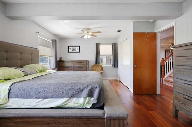 bedroom featuring baseboards, visible vents, dark wood-style flooring, and ceiling fan