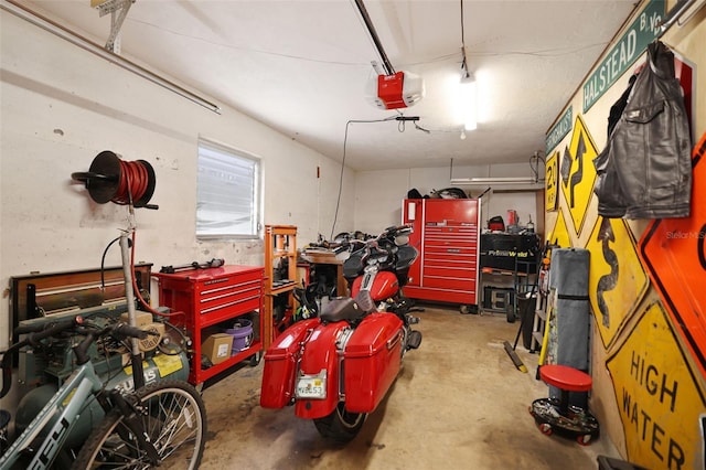 garage featuring a workshop area and a garage door opener