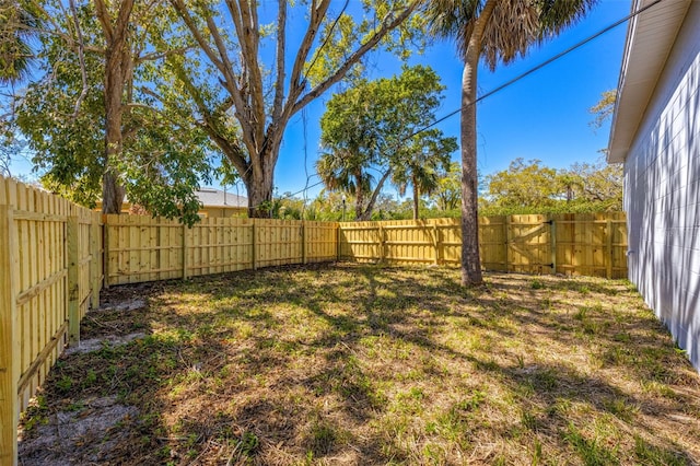 view of yard with a fenced backyard