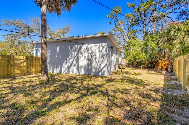 exterior space with a yard and a fenced backyard