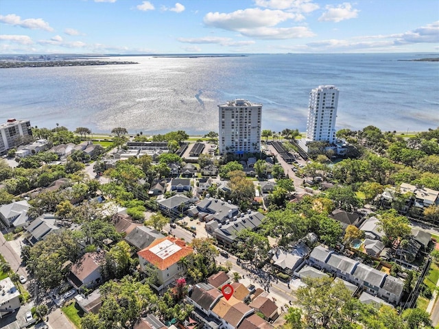 birds eye view of property featuring a view of city and a water view