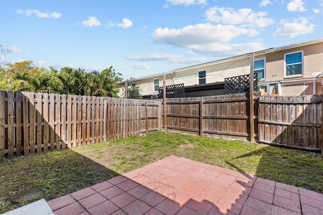 view of yard with a patio and a fenced backyard