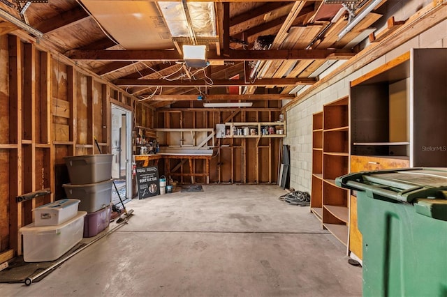 garage with concrete block wall