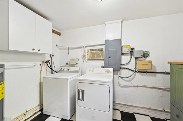 washroom with electric panel, cabinet space, washing machine and clothes dryer, and a wall unit AC