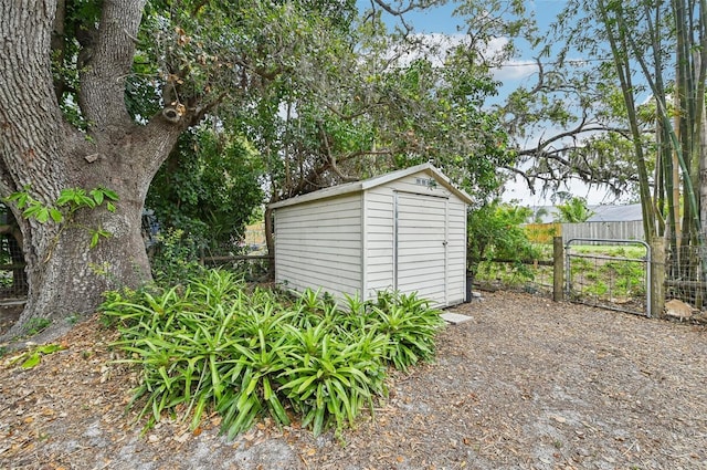 view of shed with fence