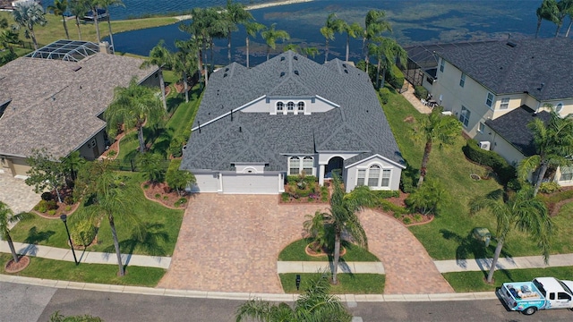 bird's eye view with a residential view and a water view