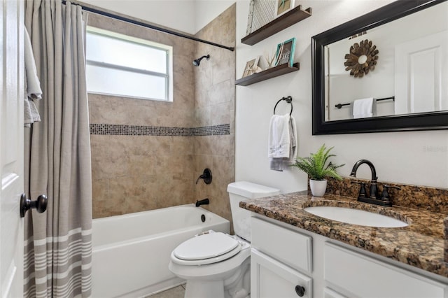 bathroom with shower / tub combo with curtain, vanity, and toilet