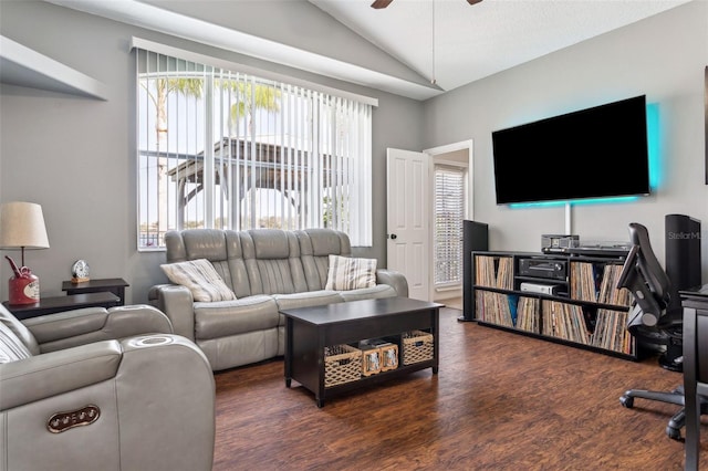 living room featuring a wealth of natural light, lofted ceiling, wood finished floors, and a ceiling fan