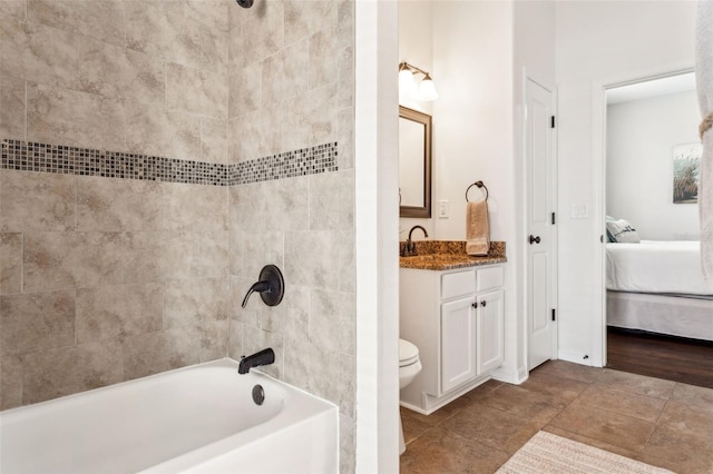 full bathroom with toilet, shower / washtub combination, connected bathroom, tile patterned flooring, and vanity