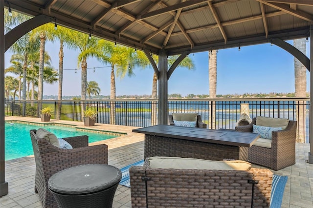 view of patio / terrace featuring a gazebo, a fenced in pool, and fence