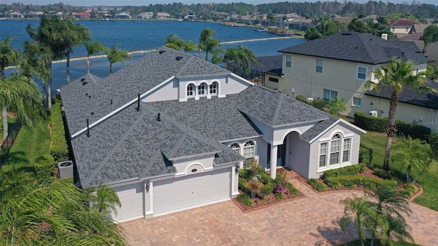 birds eye view of property with a water view